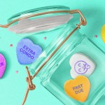 Valentine's candy hearts that say: big spender, extra condo, past due, and secret stash.